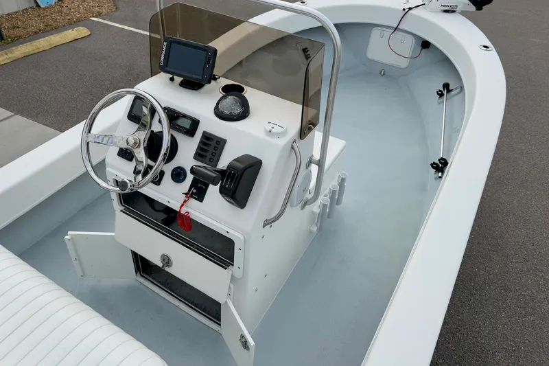 Slide: The Image of 2020 Privateer 1800 Retriever boat interior with steering console and navigation equipment. - 21