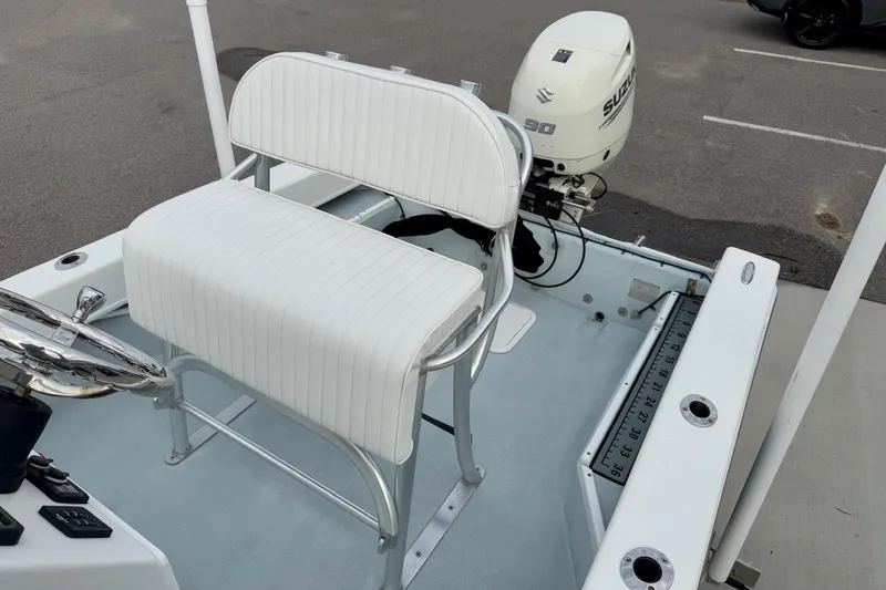 Slide: The Image of 2020 Privateer 1800 Retriever boat with Suzuki 90 outboard motor and white seating. - 24