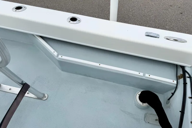 Slide: The Image of 2020 Privateer 1800 Retriever boat interior with rod holders and storage compartment. - 28