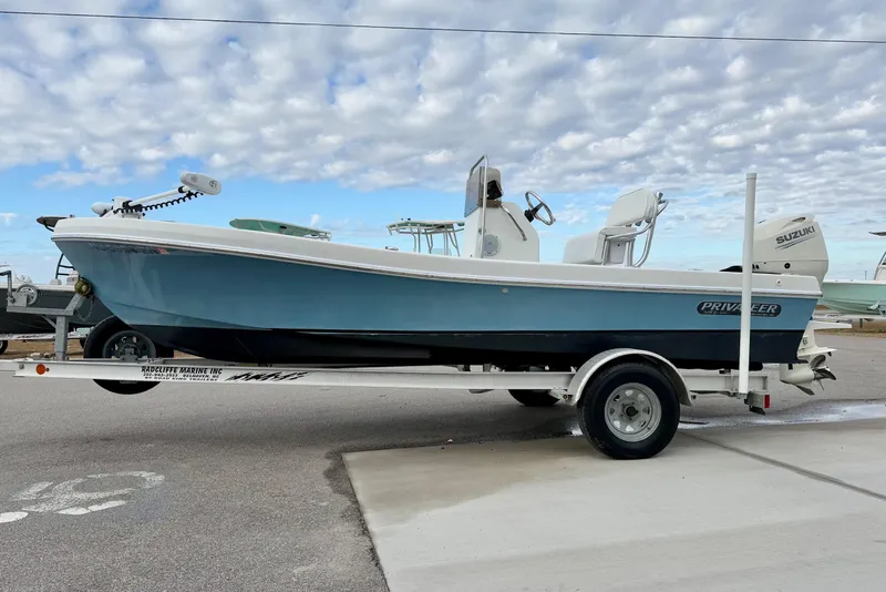 Slide: The Image of 2020 Privateer 1800 Retriever boat on trailer under cloudy sky. - 5