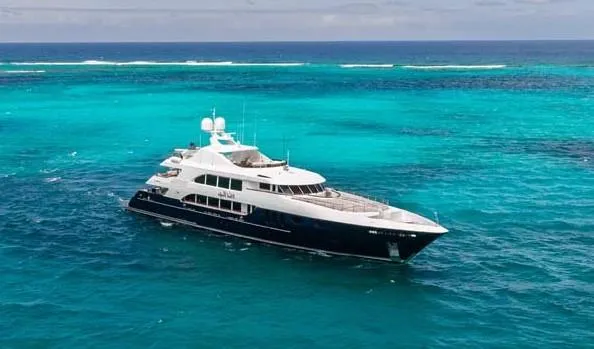 The Image of Luxurious 2005 Trinity Yachts Tri-Deck cruising on open water. - 0