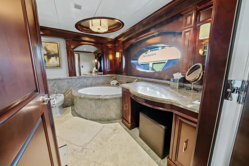 Slide: The Image of Luxurious bathroom on 2005 Trinity Yachts Tri-Deck with elegant wood finishes and marble accents. - 14