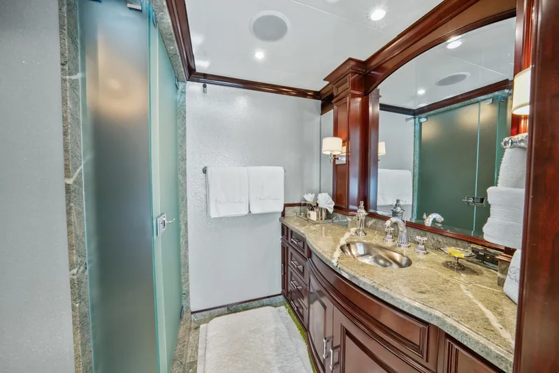 Slide: The Image of Luxurious bathroom on 2005 Trinity Yachts Tri-Deck with elegant wood cabinetry and modern fixtures. - 15