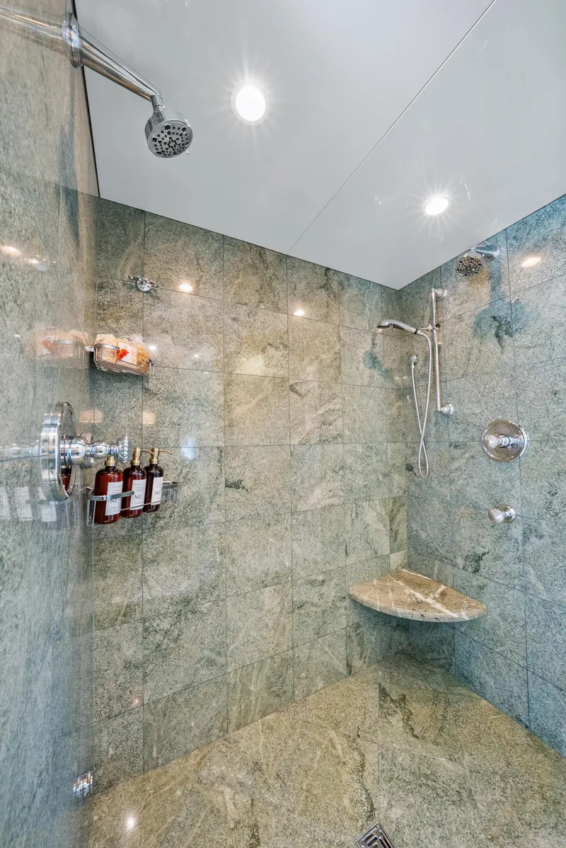 Slide: The Image of Luxurious marble shower in 2005 Trinity Yachts Tri-Deck, featuring modern fixtures and amenities. - 16