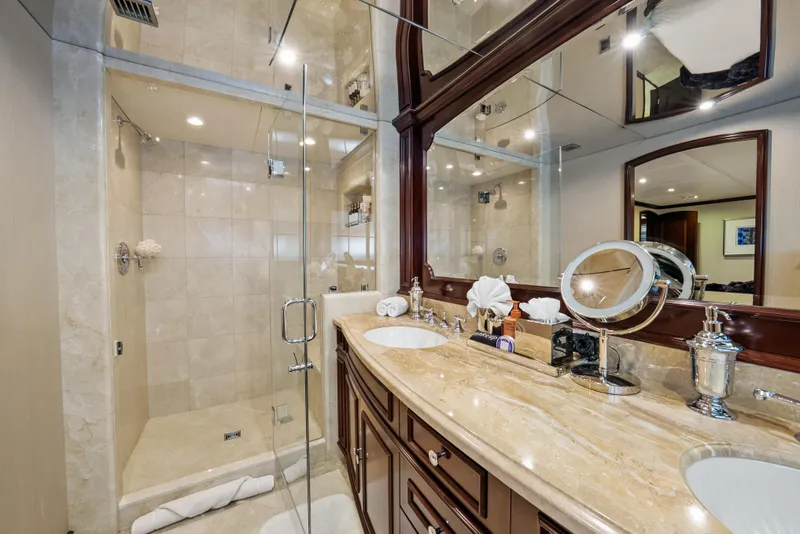 Slide: The Image of Luxurious bathroom on 2005 Trinity Yachts Tri-Deck with marble countertops and glass shower. - 29