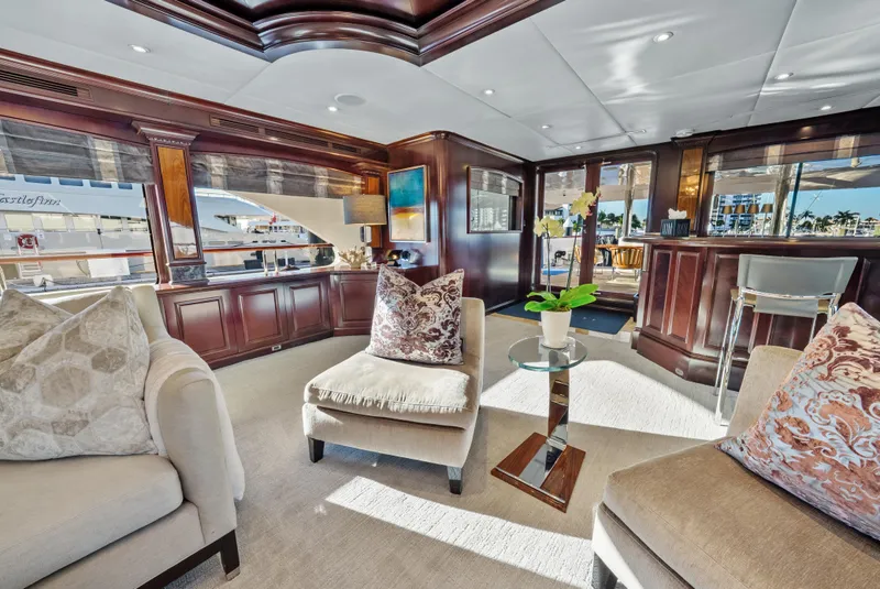 Slide: The Image of Luxurious 2005 Trinity Yachts Tri-Deck interior with elegant seating and rich wood finishes. - 3