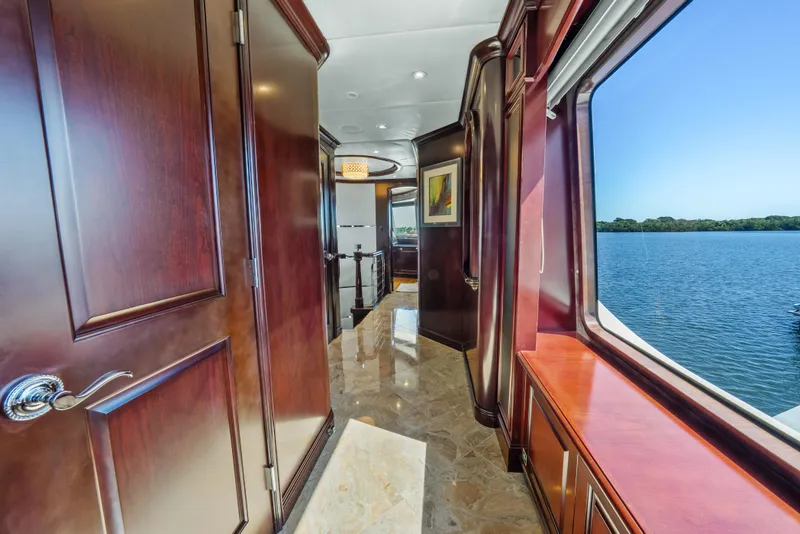 Slide: The Image of Luxurious interior of 2005 Trinity Yachts Tri-Deck with wood paneling and scenic water view. - 32