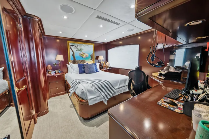 Slide: The Image of Luxurious bedroom interior on 2005 Trinity Yachts Tri-Deck, featuring elegant wood finishes. - 35