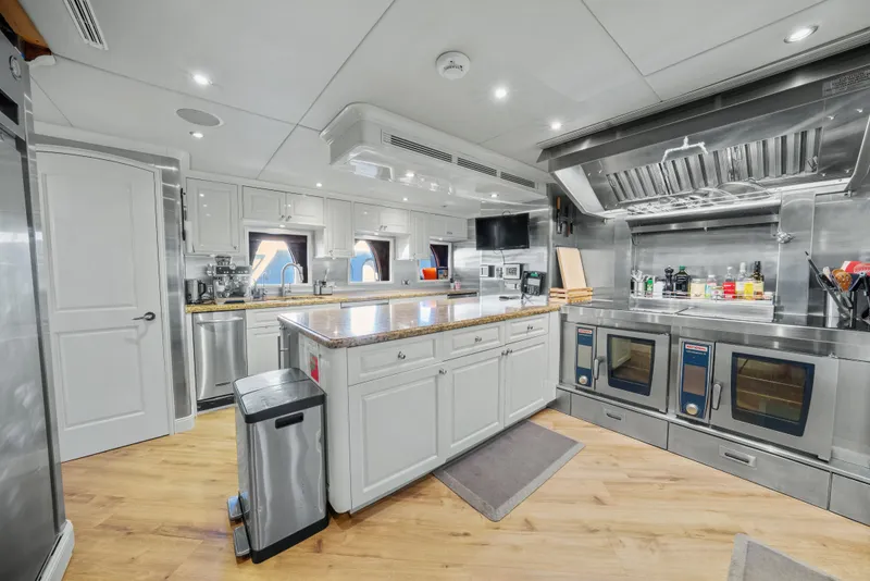 Slide: The Image of Luxurious kitchen interior of 2005 Trinity Yachts Tri-Deck, featuring modern appliances and sleek design. - 39