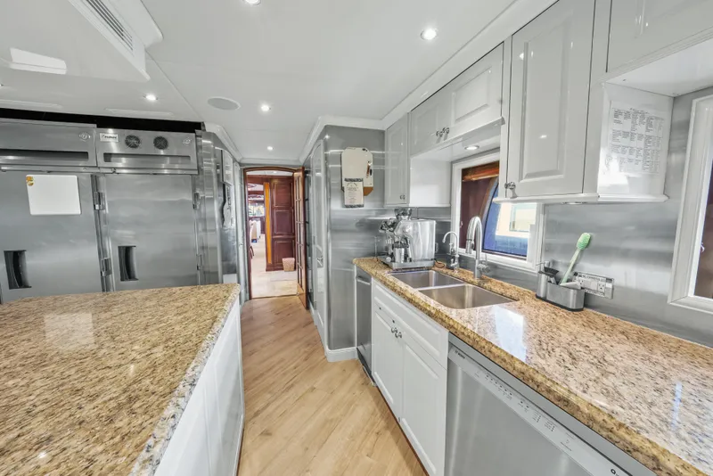 Slide: The Image of Luxurious kitchen interior on 2005 Trinity Yachts Tri-Deck with granite countertops and stainless appliances. - 40