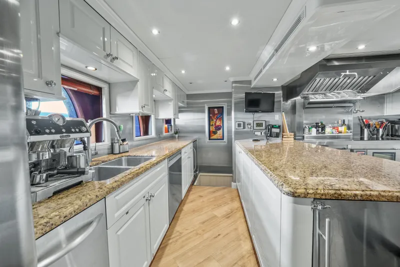 Slide: The Image of Luxurious kitchen on 2005 Trinity Yachts Tri-Deck, featuring granite countertops and modern appliances. - 41