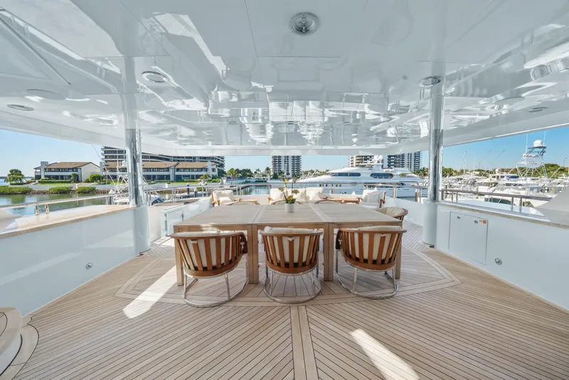 Slide: The Image of Luxurious 2005 Trinity Yachts Tri-Deck with elegant outdoor dining area and marina view. - 42