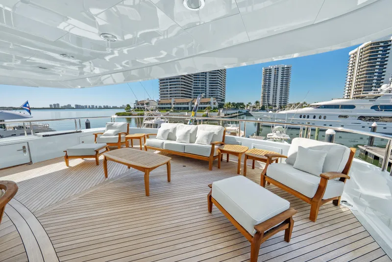 Slide: The Image of Luxurious 2005 Trinity Yachts Tri-Deck with elegant outdoor seating and marina view. - 44