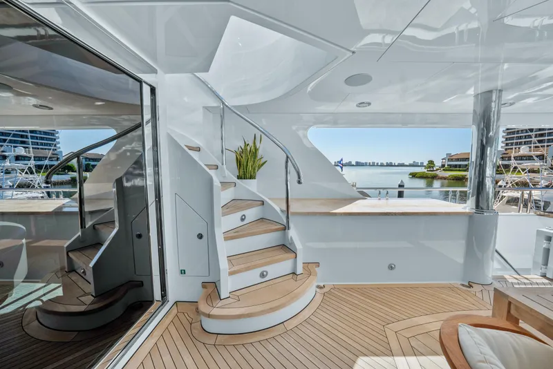 Slide: The Image of Luxurious 2005 Trinity Yachts Tri-Deck interior with elegant staircase and waterfront view. - 47