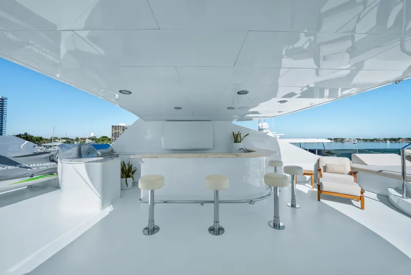 Slide: The Image of Luxurious 2005 Trinity Yachts Tri-Deck with sleek outdoor bar and seating area. - 49