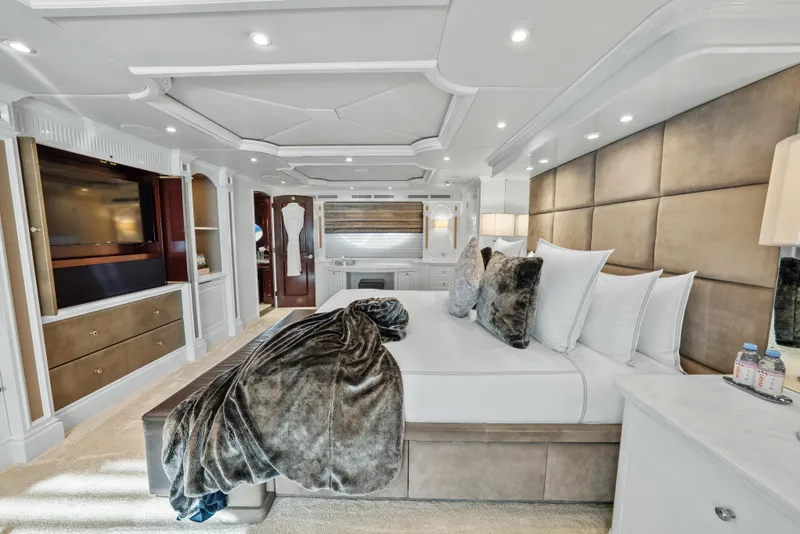 Slide: The Image of Luxurious bedroom interior on 2005 Trinity Yachts Tri-Deck, featuring elegant decor and plush bedding. - 12