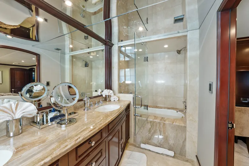 Slide: The Image of Luxurious bathroom on 2005 Trinity Yachts Tri-Deck with marble countertops and glass shower. - 25