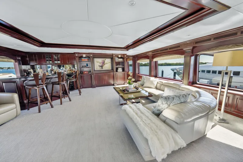 Slide: The Image of Luxurious interior of 2005 Trinity Yachts Tri-Deck with elegant seating and panoramic windows. - 30