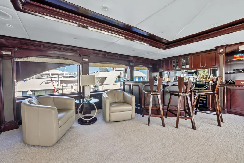 Slide: The Image of Luxurious interior of 2005 Trinity Yachts Tri-Deck with elegant seating and bar area. - 31