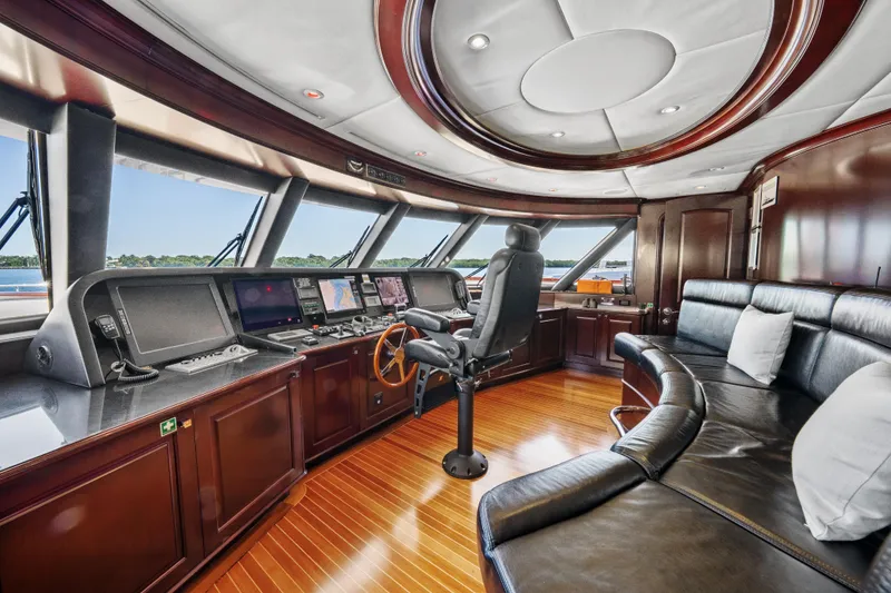 Slide: The Image of Luxurious 2005 Trinity Yachts Tri-Deck helm with leather seating and advanced navigation systems. - 33