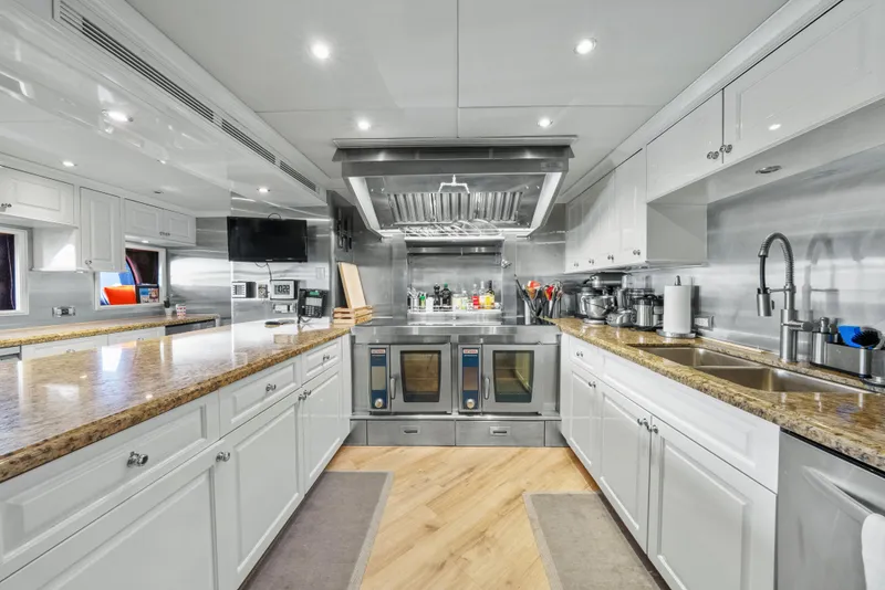 Slide: The Image of Luxurious kitchen interior on 2005 Trinity Yachts Tri-Deck, featuring modern appliances and sleek design. - 38