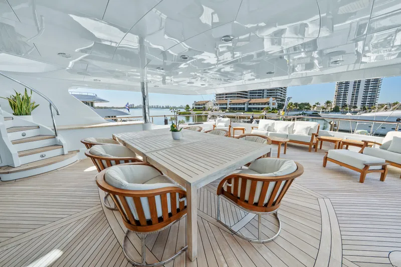 Slide: The Image of Luxurious 2005 Trinity Yachts Tri-Deck with elegant outdoor seating and dining area. - 43