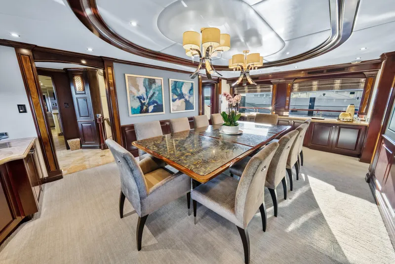 Slide: The Image of Luxurious dining area on 2005 Trinity Yachts Tri-Deck, featuring elegant decor and large windows. - 6
