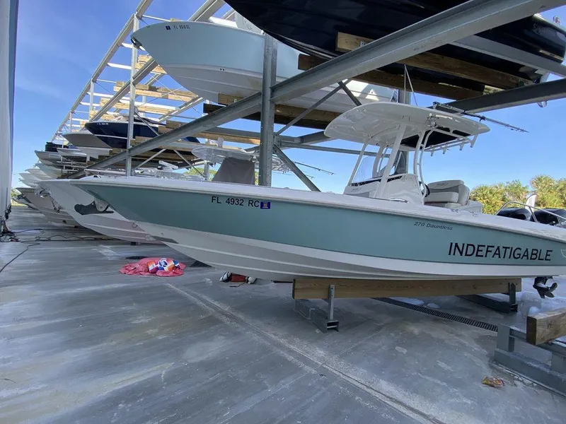Slide: The Image of 2016 Boston Whaler 270 Dauntless boat in storage, side view. - 12