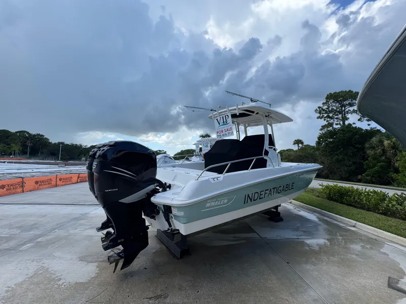 Slide: The Image of 2016 Boston Whaler 270 Dauntless boat for sale, parked on a concrete surface. - 14