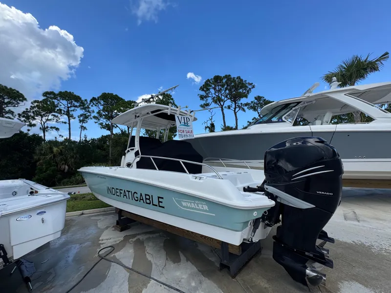Slide: The Image of 2016 Boston Whaler 270 Dauntless boat for sale, displayed outdoors under blue sky. - 16