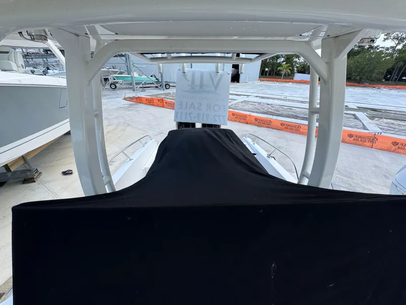 Slide: The Image of 2016 Boston Whaler 270 Dauntless boat covered and for sale at a marina. - 18