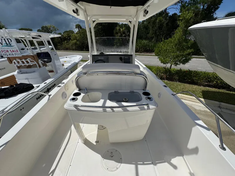 Slide: The Image of 2016 Boston Whaler 270 Dauntless boat interior with console and seating area. - 22