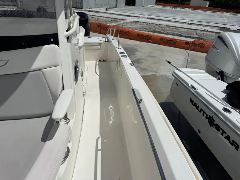 Slide: The Image of 2016 Boston Whaler 270 Dauntless boat interior with seating and deck view. - 25