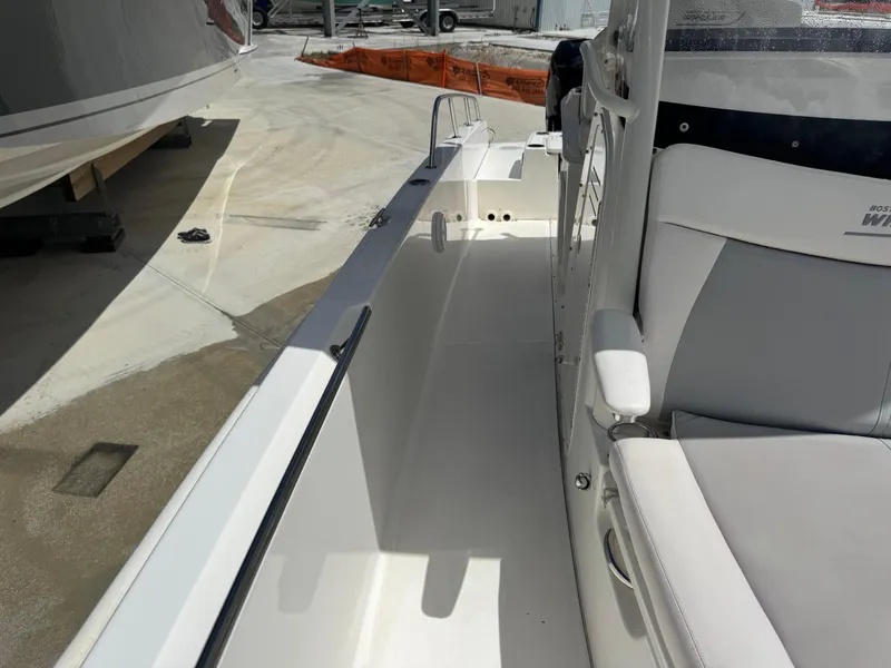 Slide: The Image of 2016 Boston Whaler 270 Dauntless boat interior, featuring seating and deck details. - 26