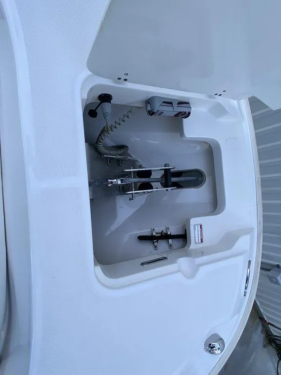 Slide: The Image of 2016 Boston Whaler 270 Dauntless anchor compartment, showcasing storage and equipment. - 3