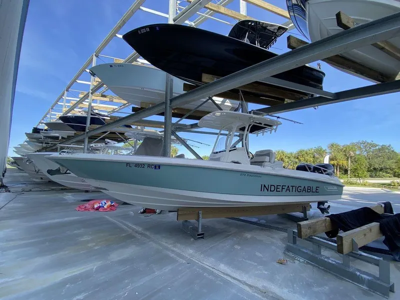 Slide: The Image of 2016 Boston Whaler 270 Dauntless boat stored on a rack in a marina. - 5