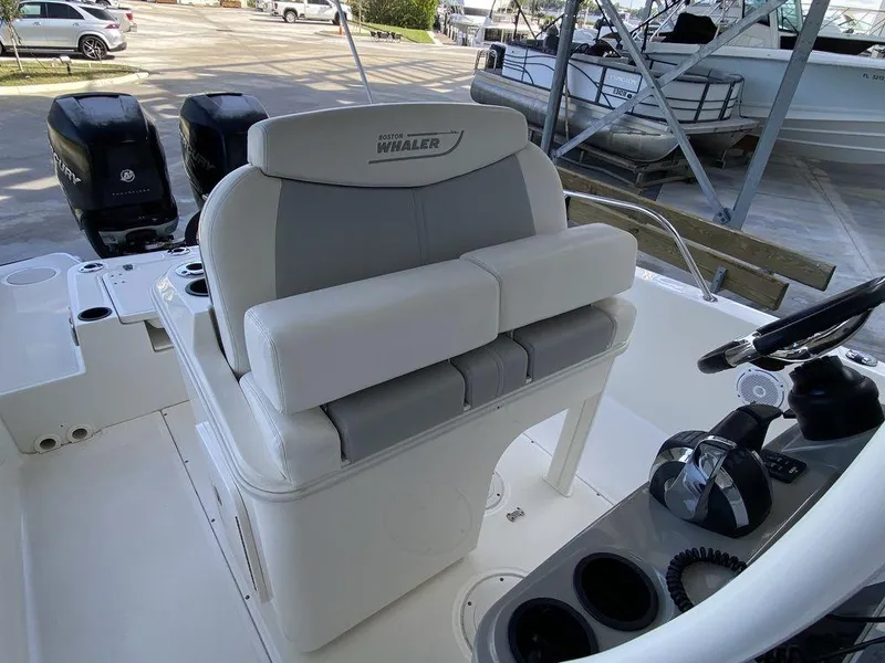 Slide: The Image of 2016 Boston Whaler 270 Dauntless boat interior with helm seating and controls. - 6