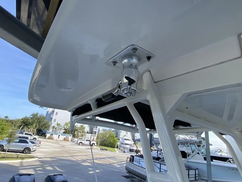 Slide: The Image of 2016 Boston Whaler 270 Dauntless boat detail, featuring a sturdy T-top structure. - 8
