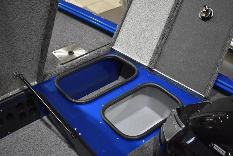 Slide: The Image of 2025 Lund 1775 Renegade SS boat interior with open storage compartments. - 13