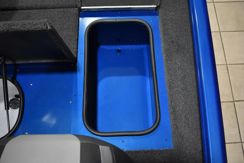 Slide: The Image of 2025 Lund 1775 Renegade SS boat interior storage compartment, blue and gray design. - 15