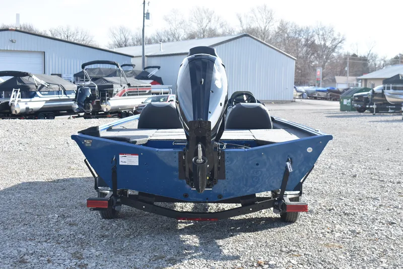 Slide: The Image of 2025 Lund 1775 Renegade SS boat on trailer, rear view in a boatyard. - 5