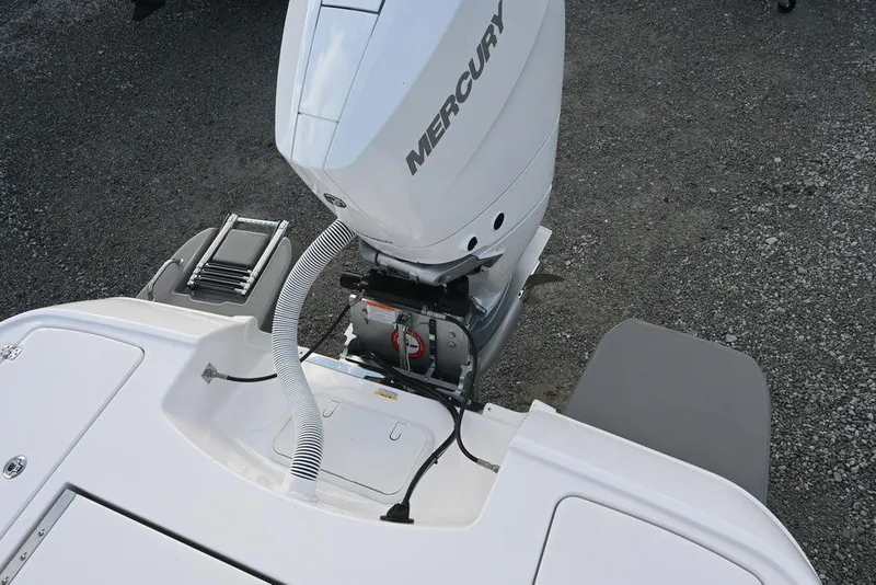 Slide: The Image of 2025 Caymas 26 HB boat with Mercury outboard motor, rear view. - 25