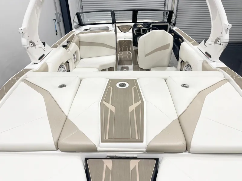 Slide: The Image of 2025 Centurion NV213 boat interior with beige and white seating, modern design. - 7