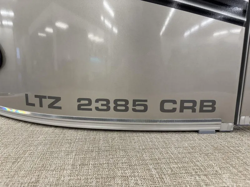 Slide: The Image of 2025 Tahoe LTZ 2385 CRB model nameplate on metallic surface. - 7