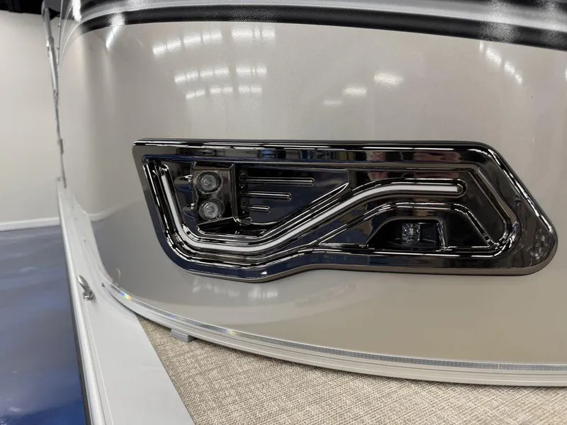 Slide: The Image of 2025 Tahoe LTZ 2385 CRB boat with sleek chrome detailing and modern design. - 8