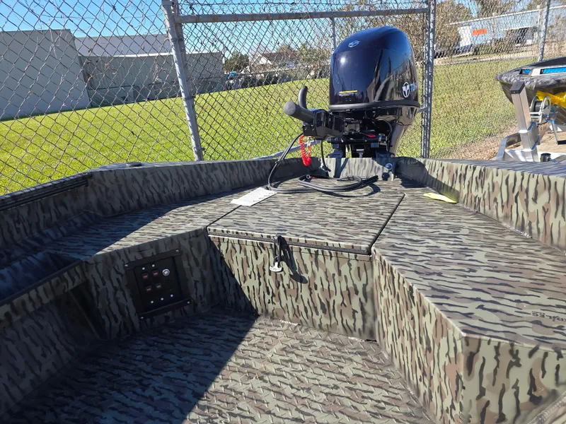 Slide: The Image of 2025 Edge Duck Boats 753 DB with Tohatsu outboard motor in a sunny outdoor setting. - 3