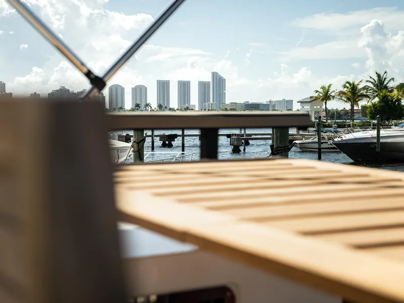 Slide: The Image of 2024 Navisyo Homes 28' NAVIS V.08 yacht docked with city skyline view. - 15