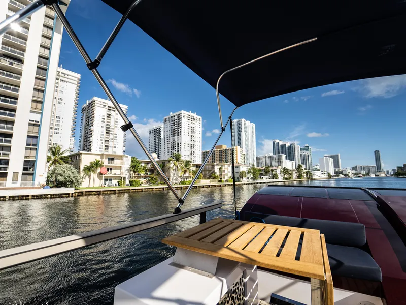 Slide: The Image of 2024 Navisyo Homes 28' NAVIS V.08 yacht with city skyline view. - 16