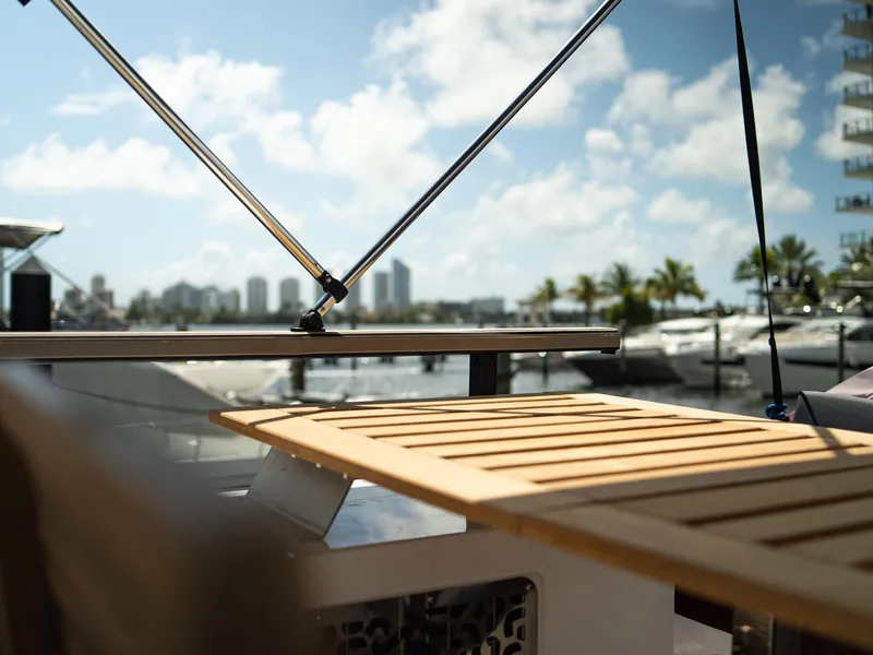 Slide: The Image of 2024 Navisyo Homes 28' NAVIS V.08 yacht deck with city skyline and marina view. - 19