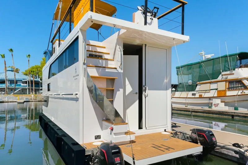 Slide: The Image of Modern 2024 Navisyo Homes 28' NAVIS V.08 houseboat docked in marina. - 3